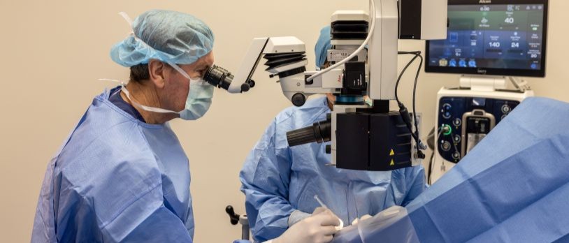 Doctor performing Ophthalmic surgery on a patient using Alcon Unity machine
